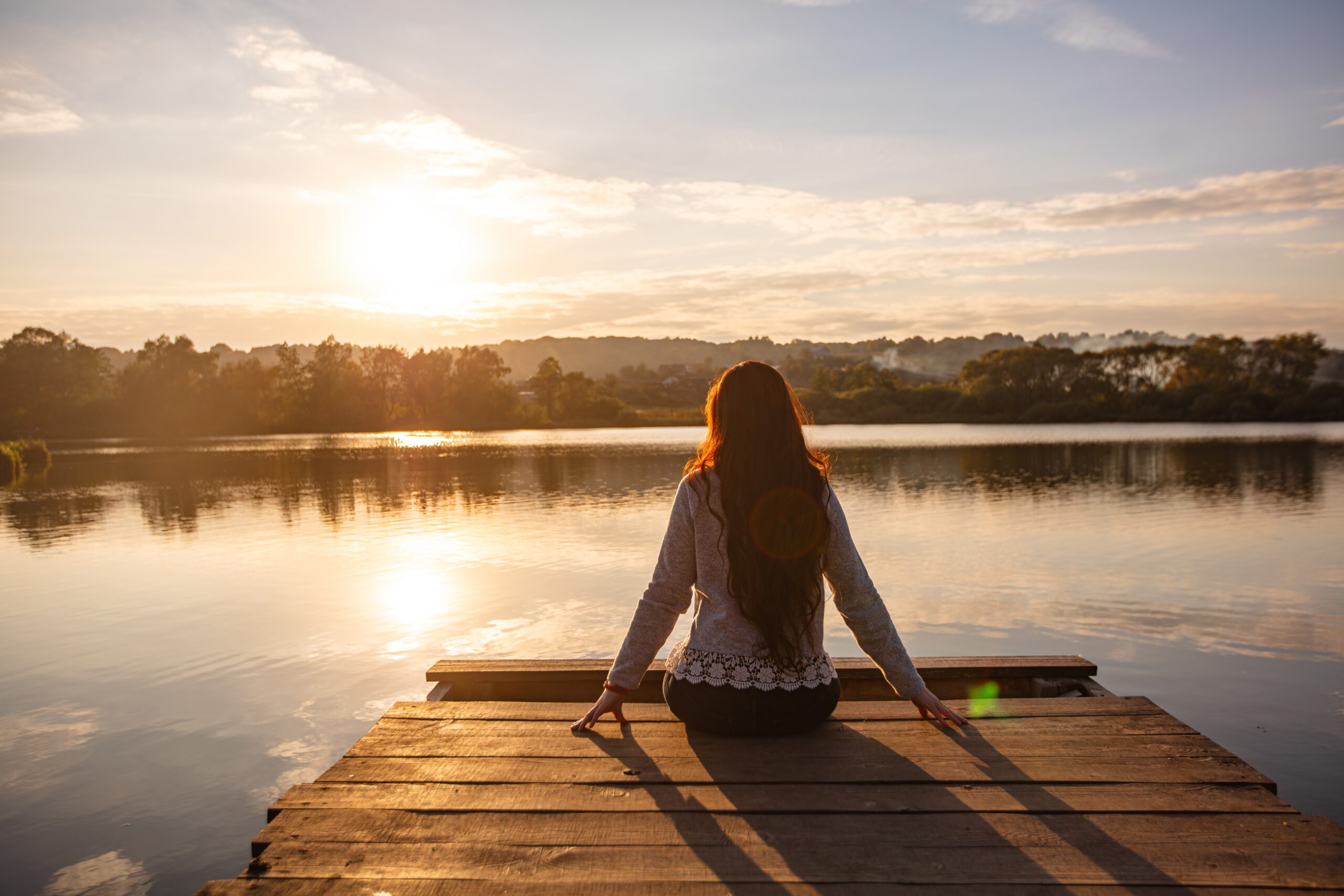 woman on dock viewing lake